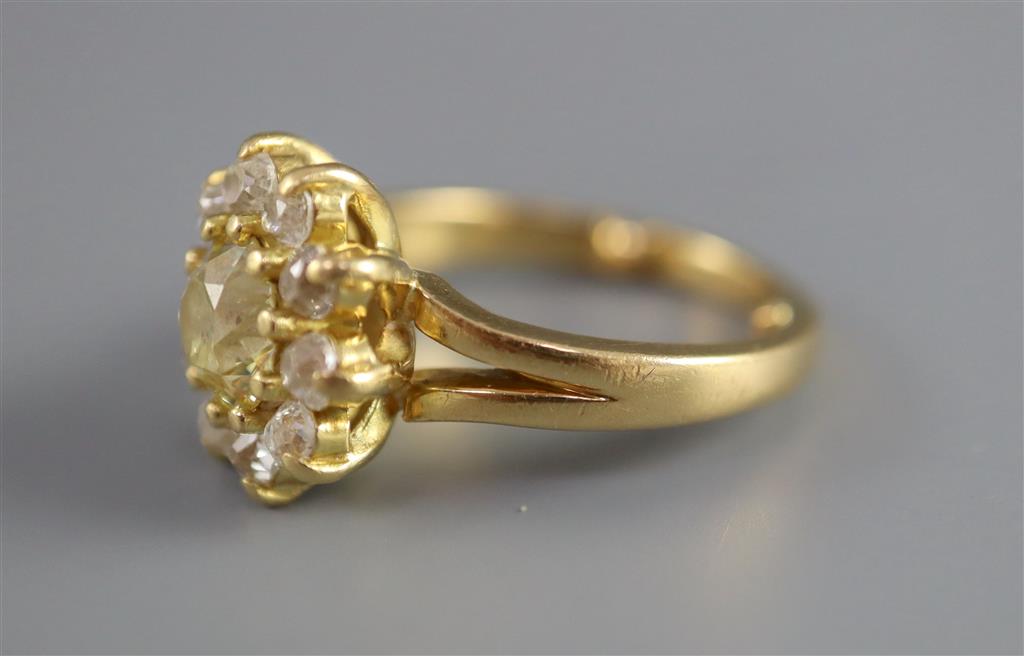 A modern 18ct gold and diamond cluster ring,